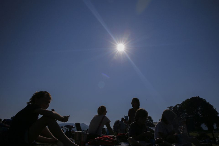 people watching a solar eclipse